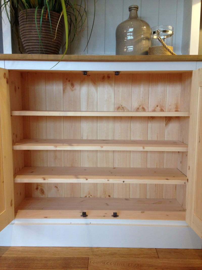 Both doors of the base cupboard opened to reveal the natural pine interior, with tongue-and-groove backboards, three full width shelves and black catches fitted to the top and bottom rails