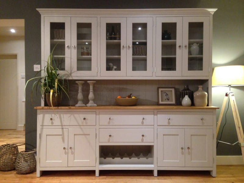 Cream painted 7ft Aspley Welsh dresser with six glazed upper doors above an oak worktop, drawers, cupboards and a central wine rack, styled with candlesticks and a bowl of fruit