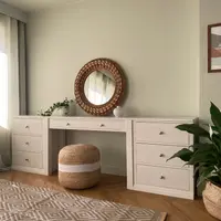 White painted Colmworth dressing table with a single drawer between two three drawer chests, beneath a round rattan mirror with a jute pouffe tucked underneath