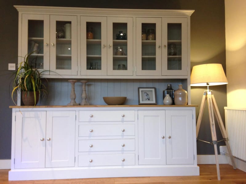 Cream painted 7ft Hinwick Welsh dresser with six glazed upper doors above an oak worktop, four central drawers and four cupboard doors, styled with candlesticks and a bowl