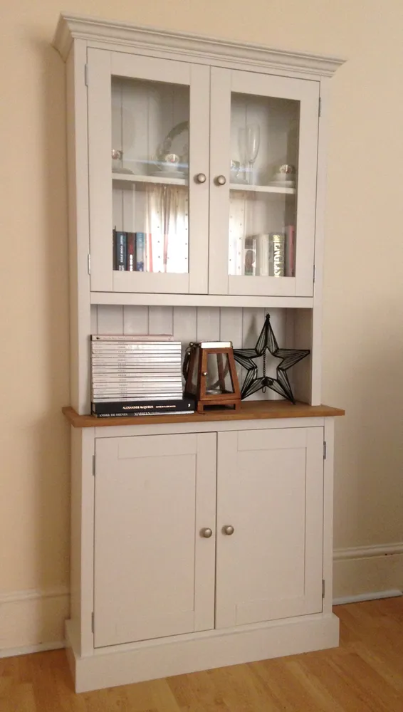 Narrow cream painted dresser with glazed top doors, cupboards and an oak top